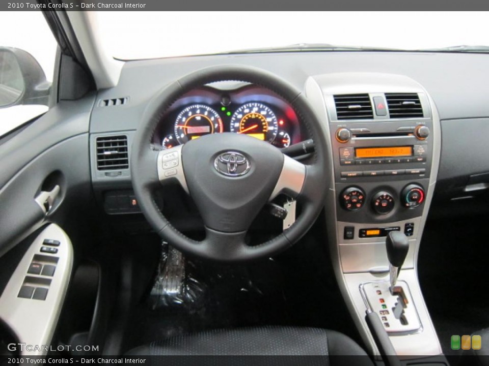 Dark Charcoal Interior Dashboard for the 2010 Toyota Corolla S #39513824