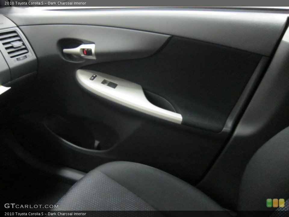Dark Charcoal Interior Door Panel for the 2010 Toyota Corolla S #39513848