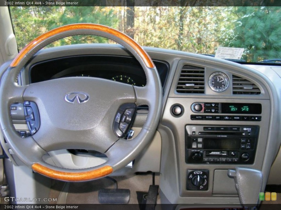 Stone Beige Interior Dashboard for the 2002 Infiniti QX4 4x4 #39515332