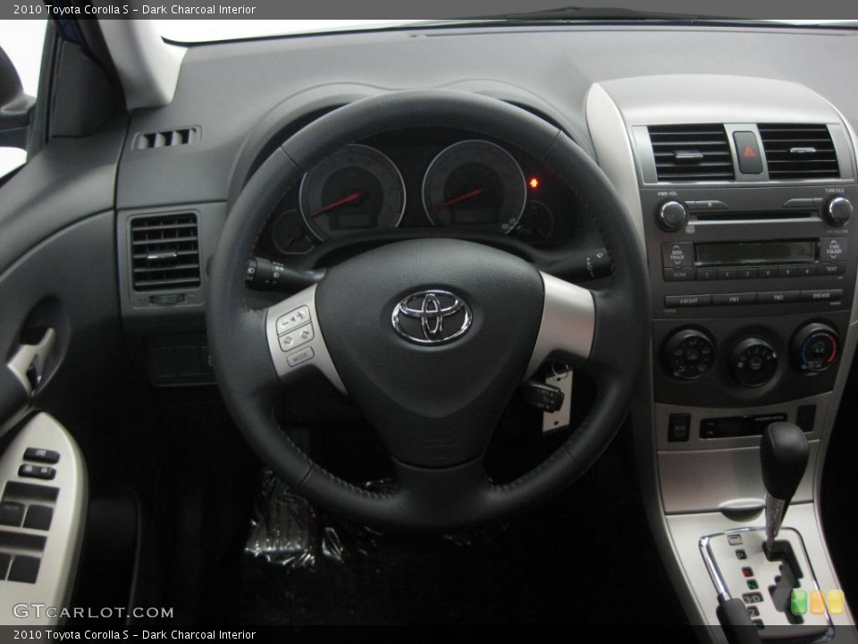 Dark Charcoal Interior Dashboard for the 2010 Toyota Corolla S #39526069