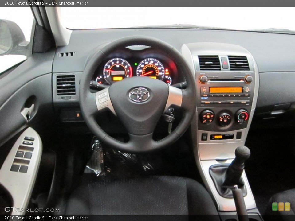 Dark Charcoal Interior Dashboard for the 2010 Toyota Corolla S #39530137
