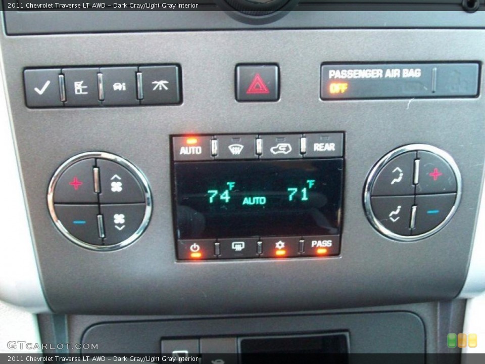 Dark Gray/Light Gray Interior Controls for the 2011 Chevrolet Traverse LT AWD #39646796