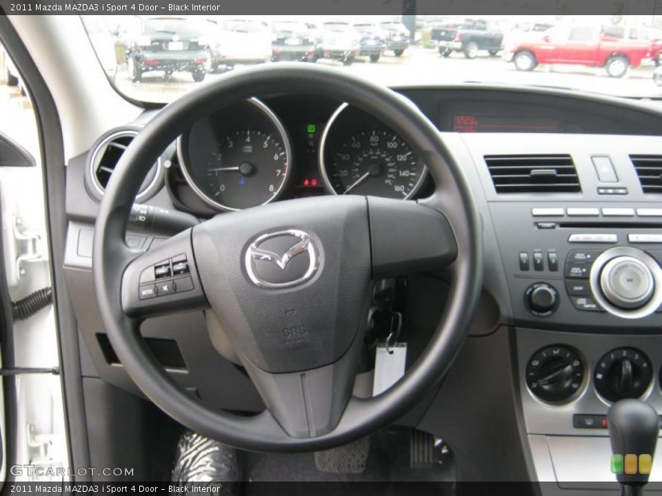 Black Interior Steering Wheel for the 2011 Mazda MAZDA3 i Sport 4 Door #39704263