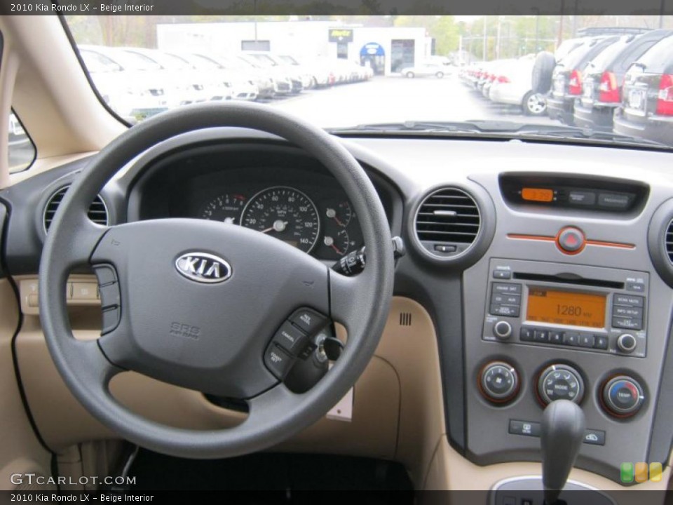 Beige Interior Dashboard for the 2010 Kia Rondo LX #39847738