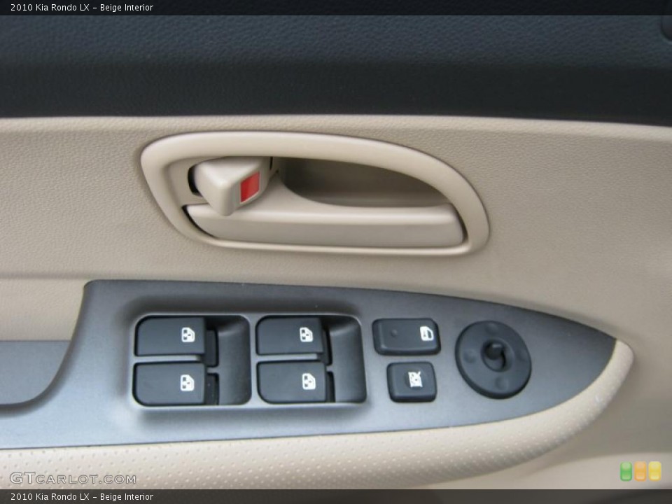 Beige Interior Controls for the 2010 Kia Rondo LX #39847958