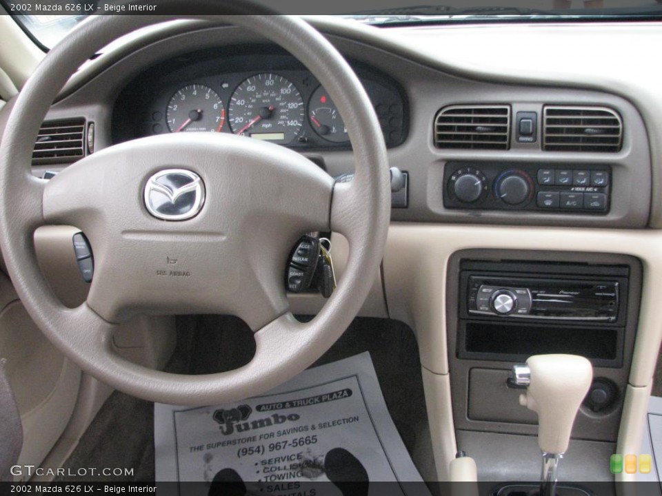 Beige Interior Dashboard for the 2002 Mazda 626 LX #39848046