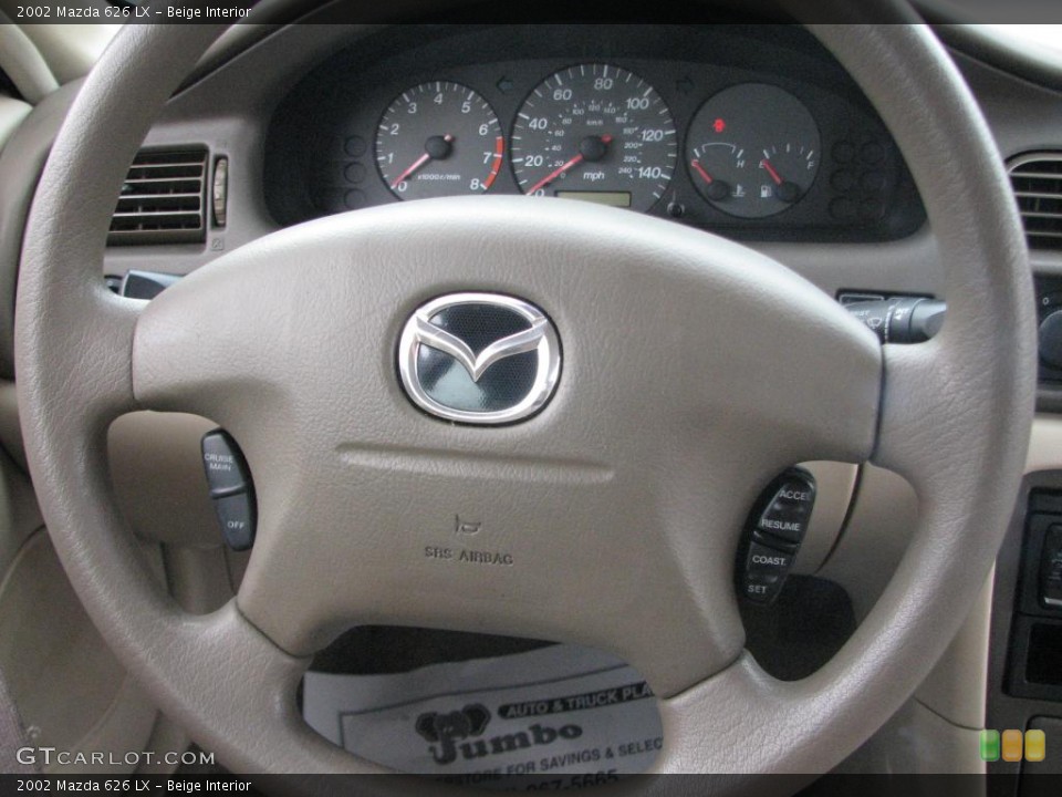 Beige Interior Steering Wheel for the 2002 Mazda 626 LX #39848106