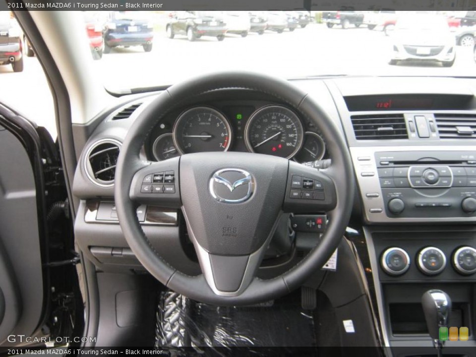 Black Interior Steering Wheel for the 2011 Mazda MAZDA6 i Touring Sedan #39900151