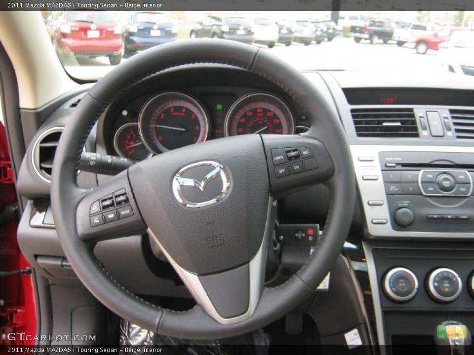 Beige Interior Steering Wheel for the 2011 Mazda MAZDA6 i Touring Sedan #39900559