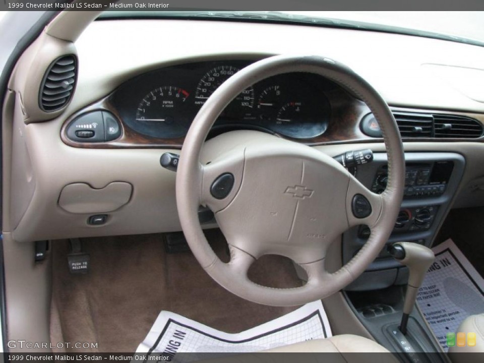 Medium Oak Interior Dashboard for the 1999 Chevrolet Malibu LS Sedan #39909831