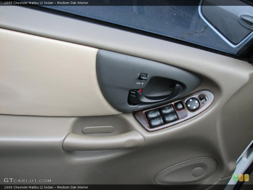 Medium Oak Interior Controls for the 1999 Chevrolet Malibu LS Sedan #39909843