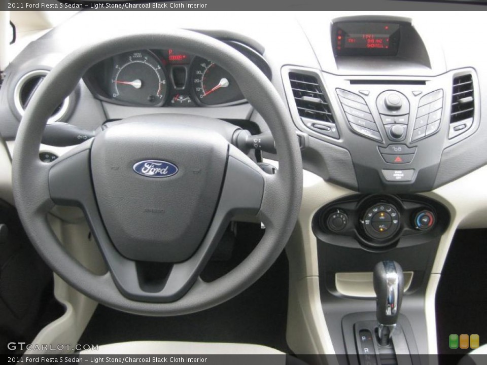 Light Stone/Charcoal Black Cloth Interior Dashboard for the 2011 Ford Fiesta S Sedan #39937480