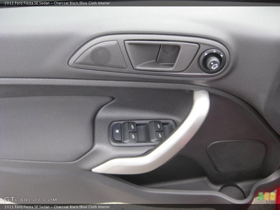 Charcoal Black/Blue Cloth Interior Door Panel for the 2011 Ford Fiesta SE Sedan #39937768