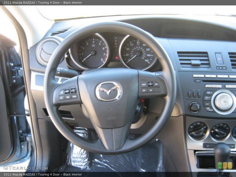 Black Interior Steering Wheel for the 2011 Mazda MAZDA3 i Touring 4 Door #40101719