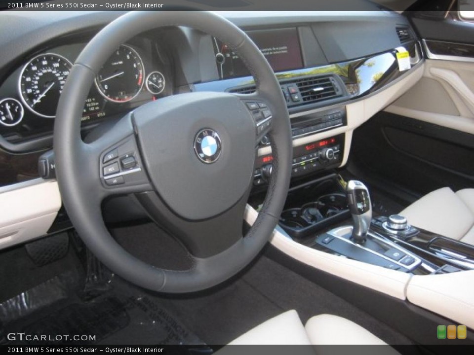 Oyster/Black Interior Dashboard for the 2011 BMW 5 Series 550i Sedan #40118671