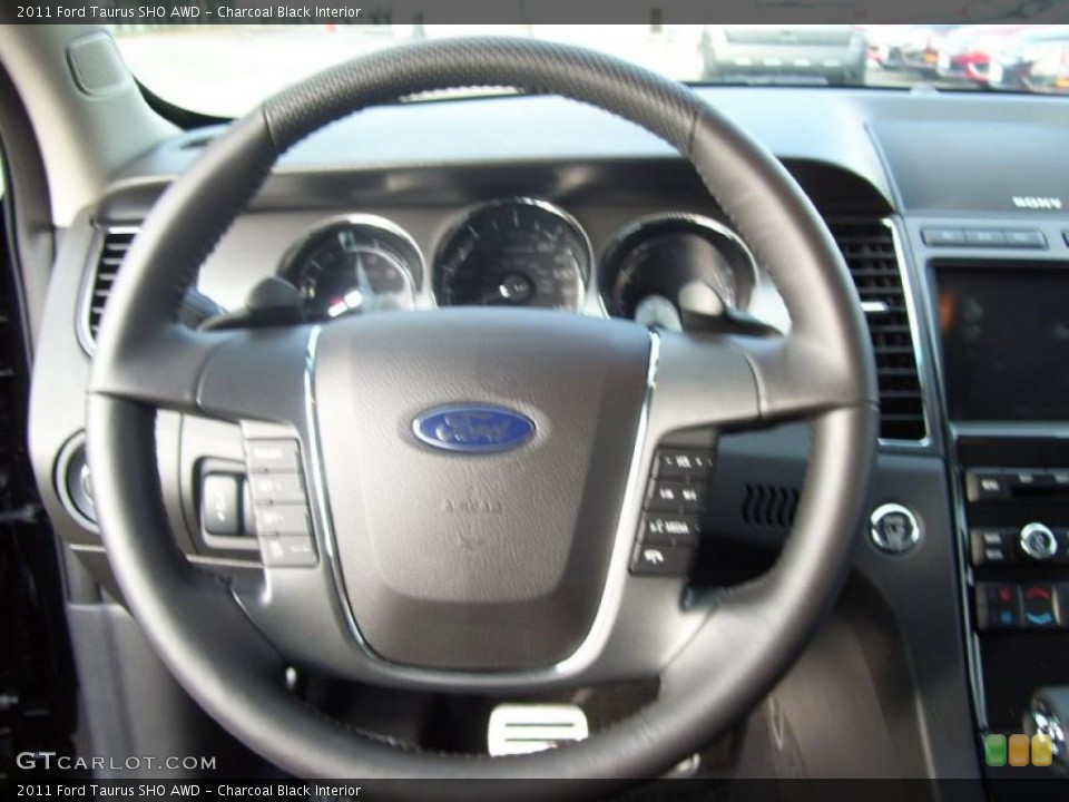 Charcoal Black Interior Steering Wheel for the 2011 Ford Taurus SHO AWD #40159781
