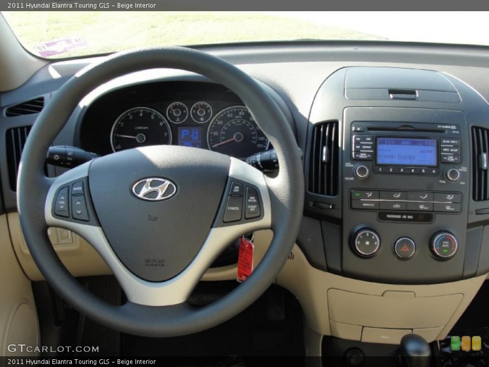 Beige Interior Dashboard for the 2011 Hyundai Elantra Touring GLS #40199488
