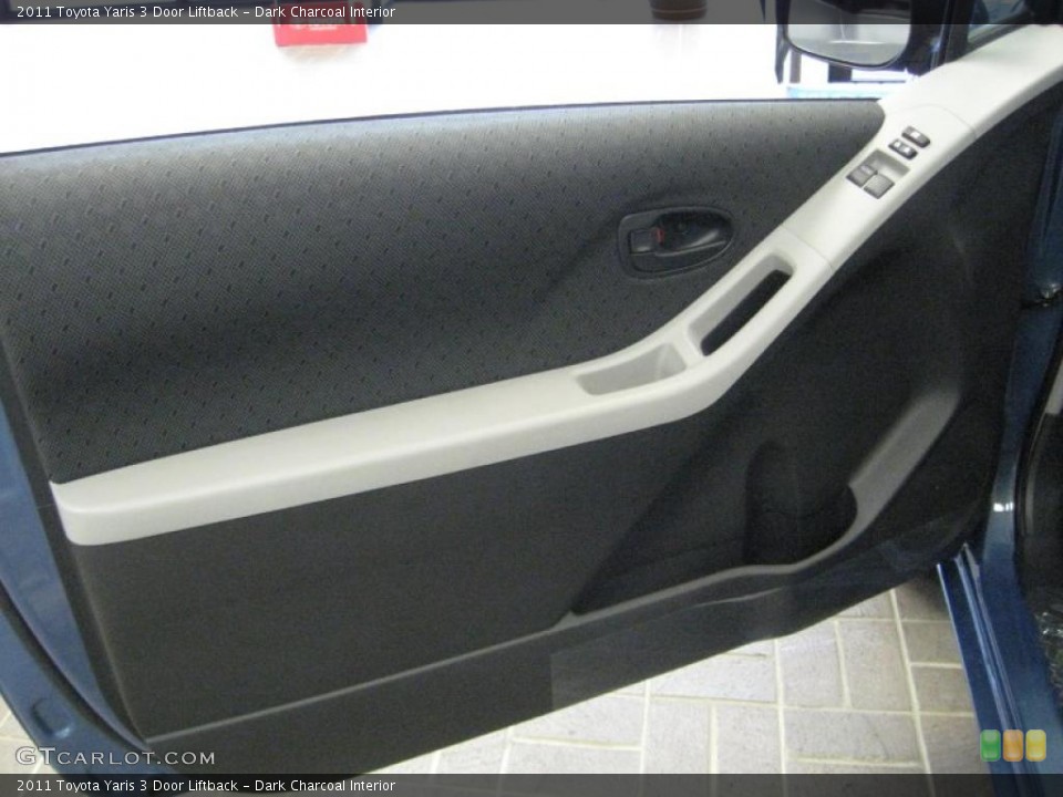 Dark Charcoal Interior Door Panel for the 2011 Toyota Yaris 3 Door Liftback #40376493