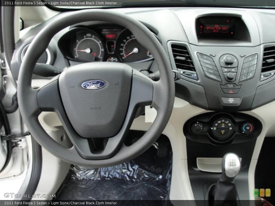 Light Stone/Charcoal Black Cloth Interior Dashboard for the 2011 Ford Fiesta S Sedan #40542369
