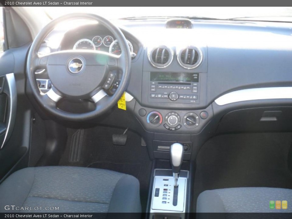 Charcoal Interior Dashboard for the 2010 Chevrolet Aveo LT Sedan #40683834