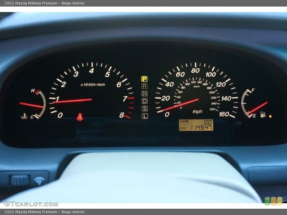 Beige Interior Gauges for the 2001 Mazda Millenia Premium #40797659