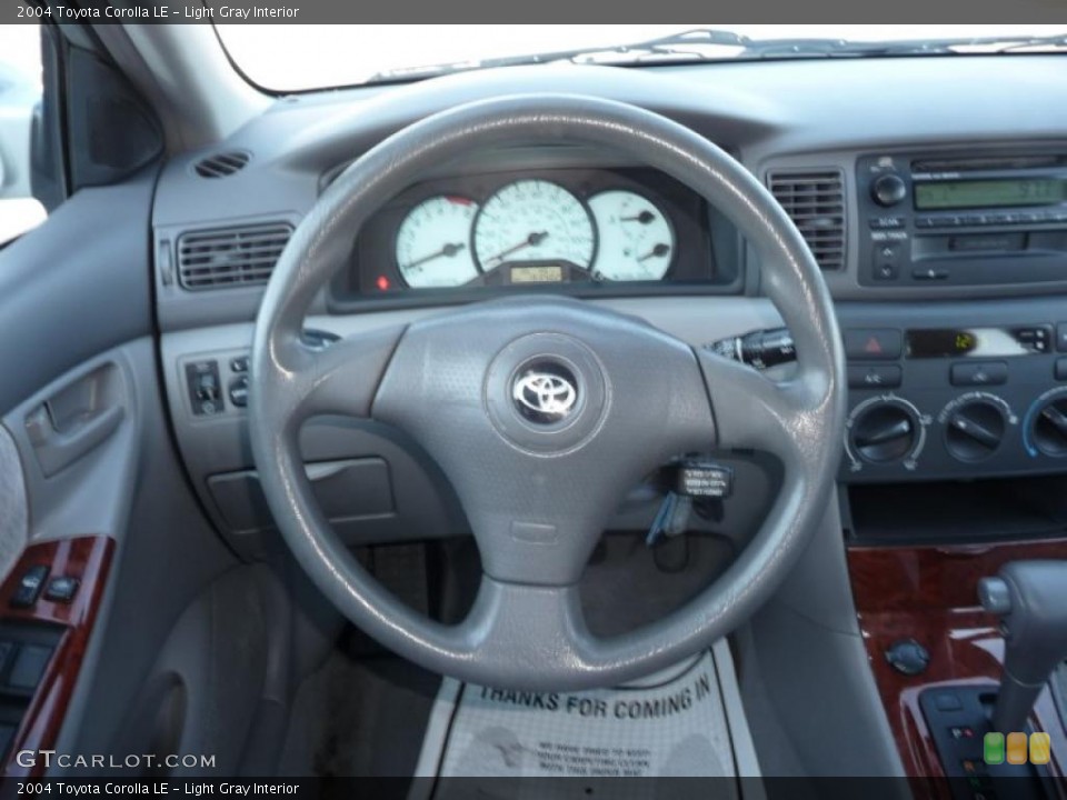 Light Gray Interior Steering Wheel for the 2004 Toyota Corolla LE #40899689