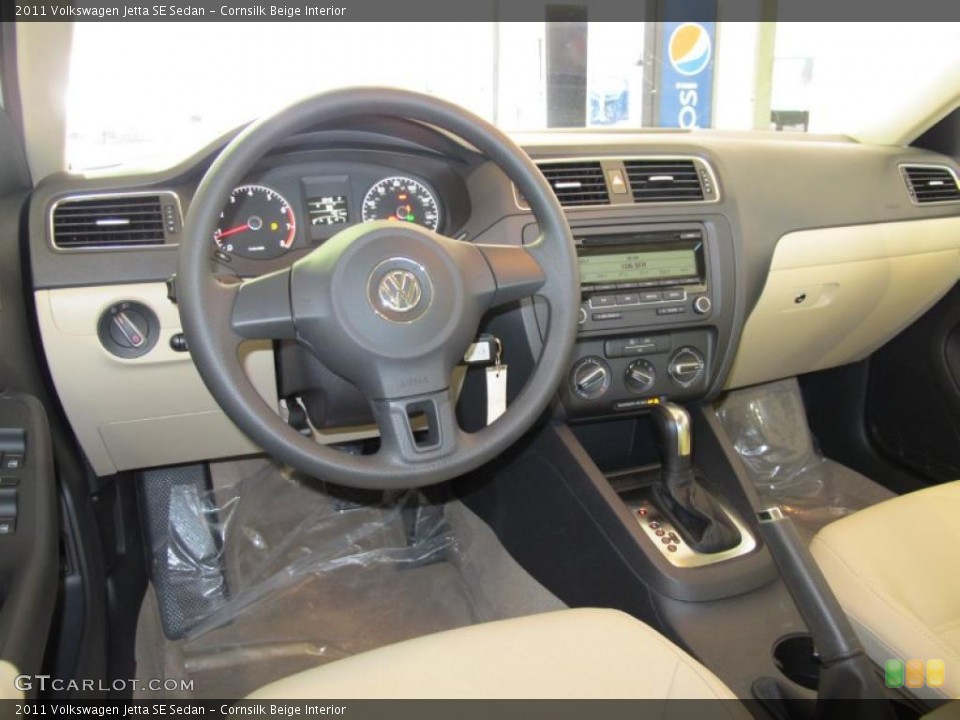 Cornsilk Beige Interior Dashboard for the 2011 Volkswagen Jetta SE Sedan #41077415