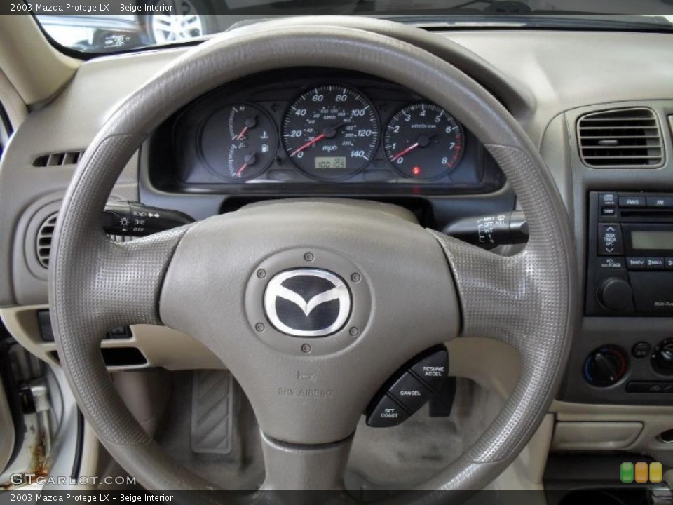 Beige Interior Steering Wheel for the 2003 Mazda Protege LX #41084375