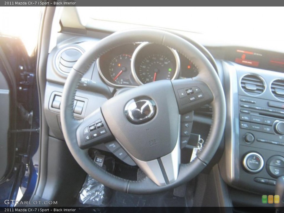 Black Interior Steering Wheel for the 2011 Mazda CX-7 i Sport #41102402