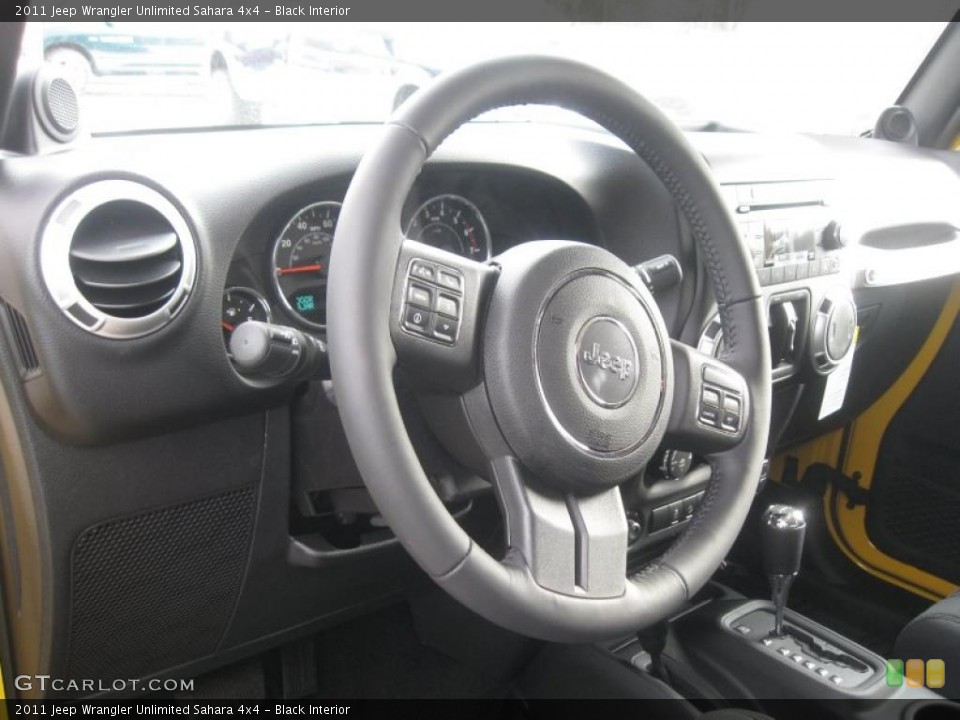 Black Interior Steering Wheel for the 2011 Jeep Wrangler Unlimited Sahara 4x4 #41249821