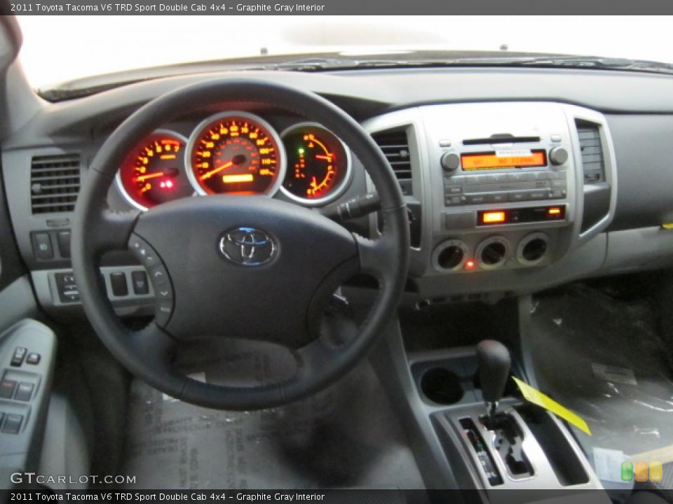 Graphite Gray Interior Dashboard for the 2011 Toyota Tacoma V6 TRD Sport Double Cab 4x4 #41305777