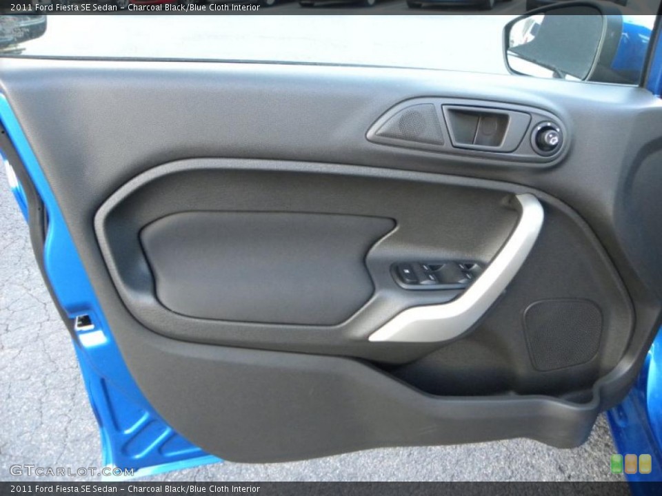 Charcoal Black/Blue Cloth Interior Door Panel for the 2011 Ford Fiesta SE Sedan #41436151