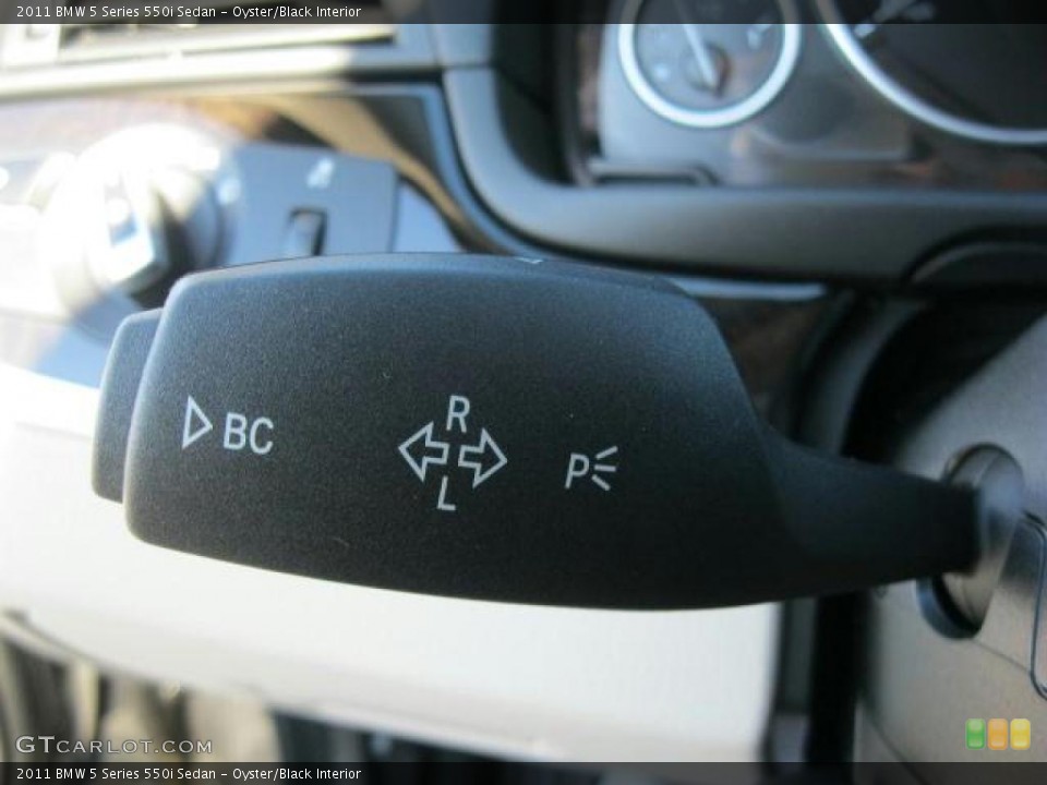Oyster/Black Interior Controls for the 2011 BMW 5 Series 550i Sedan #41532193