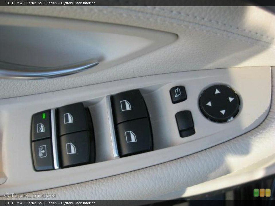 Oyster/Black Interior Controls for the 2011 BMW 5 Series 550i Sedan #41532217