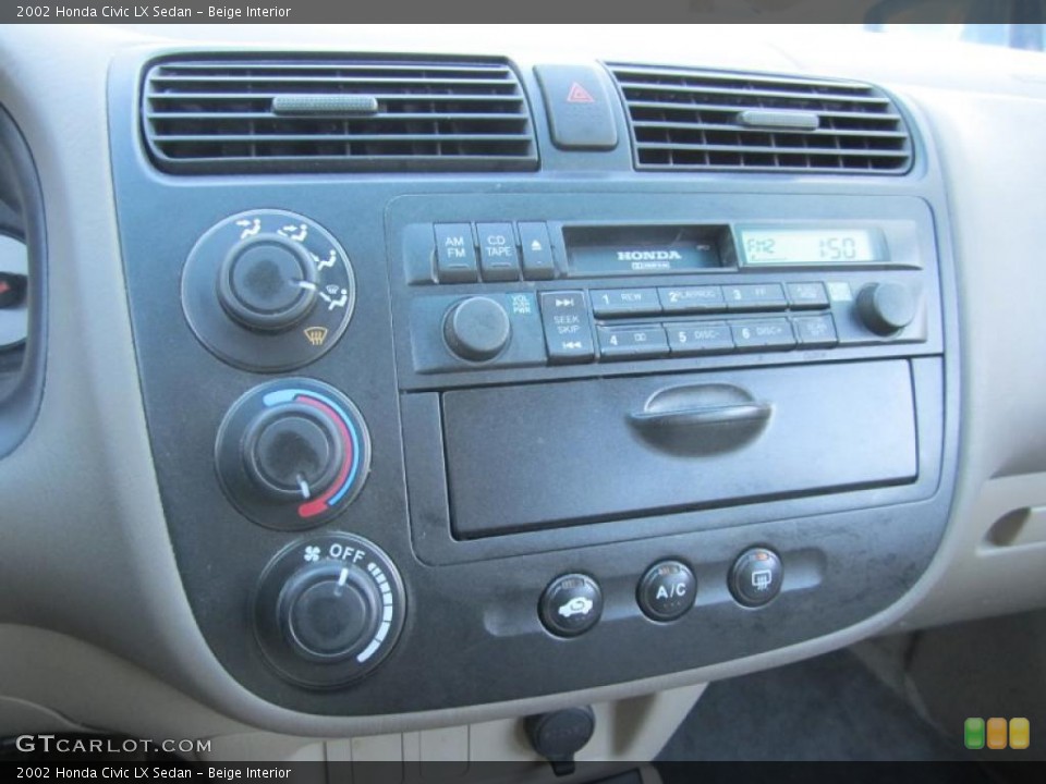 Beige Interior Controls for the 2002 Honda Civic LX Sedan #41543336