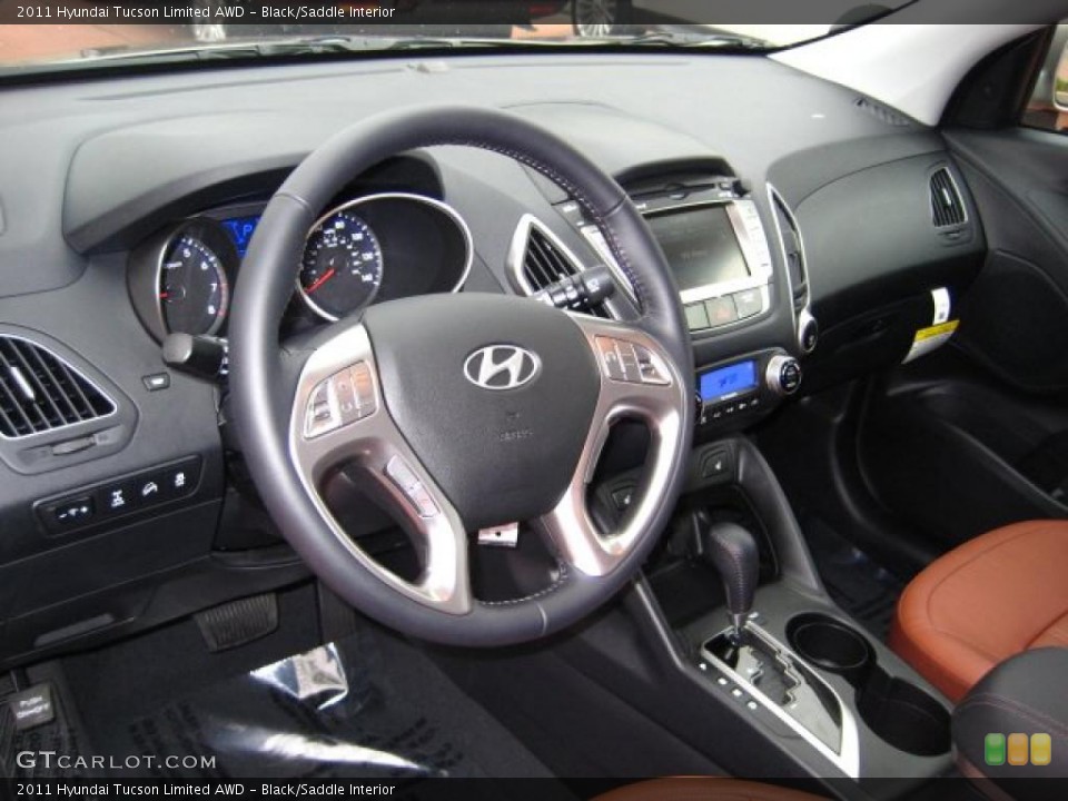 Black/Saddle Interior Prime Interior for the 2011 Hyundai Tucson Limited AWD #41606145