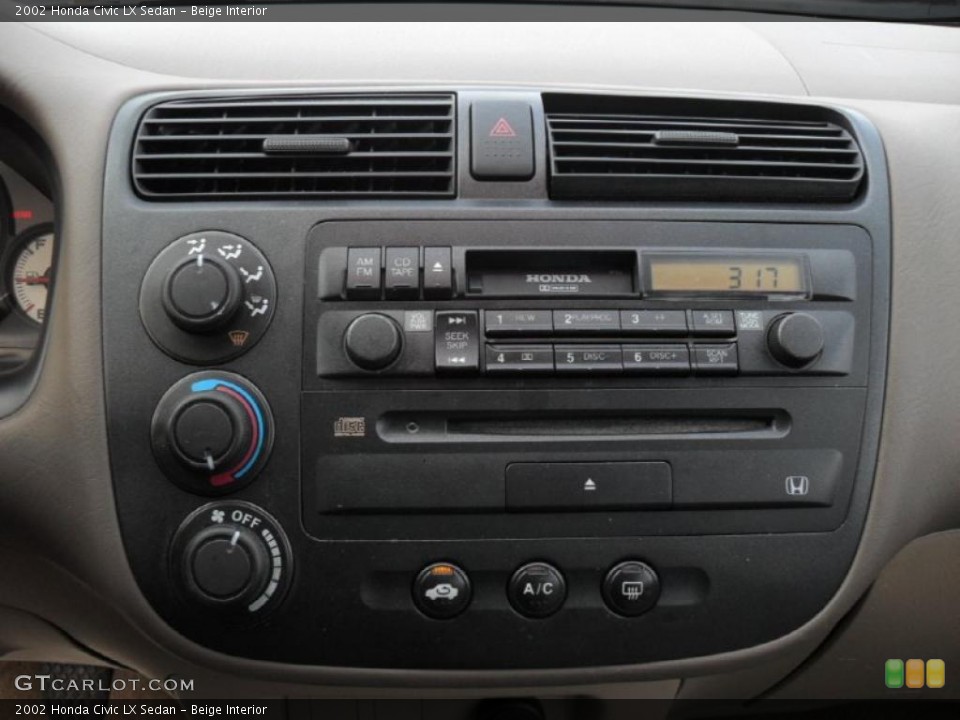 Beige Interior Controls for the 2002 Honda Civic LX Sedan #41820903
