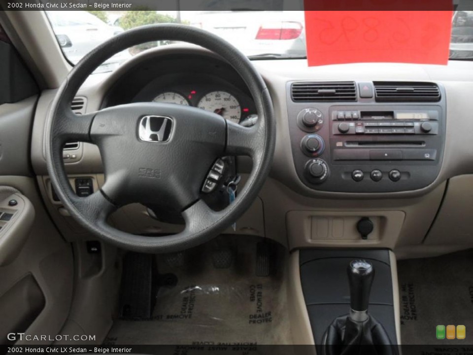 Beige Interior Dashboard for the 2002 Honda Civic LX Sedan #41820975