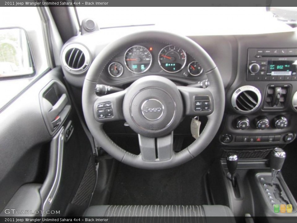 Black Interior Steering Wheel for the 2011 Jeep Wrangler Unlimited Sahara 4x4 #41824187