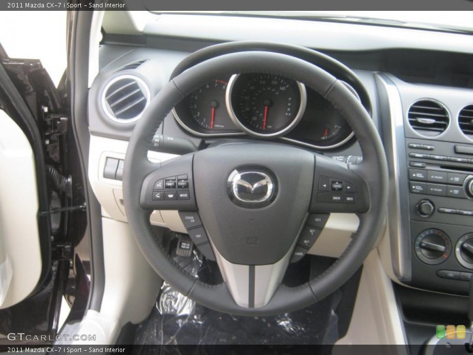 Sand Interior Steering Wheel for the 2011 Mazda CX-7 i Sport #41899152