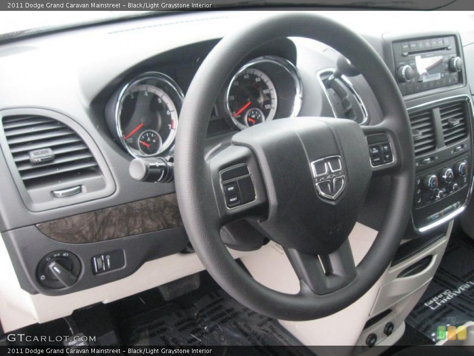 Black/Light Graystone Interior Steering Wheel for the 2011 Dodge Grand Caravan Mainstreet #42066147