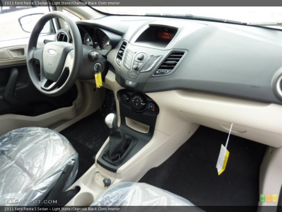 Light Stone/Charcoal Black Cloth Interior Dashboard for the 2011 Ford Fiesta S Sedan #42114701