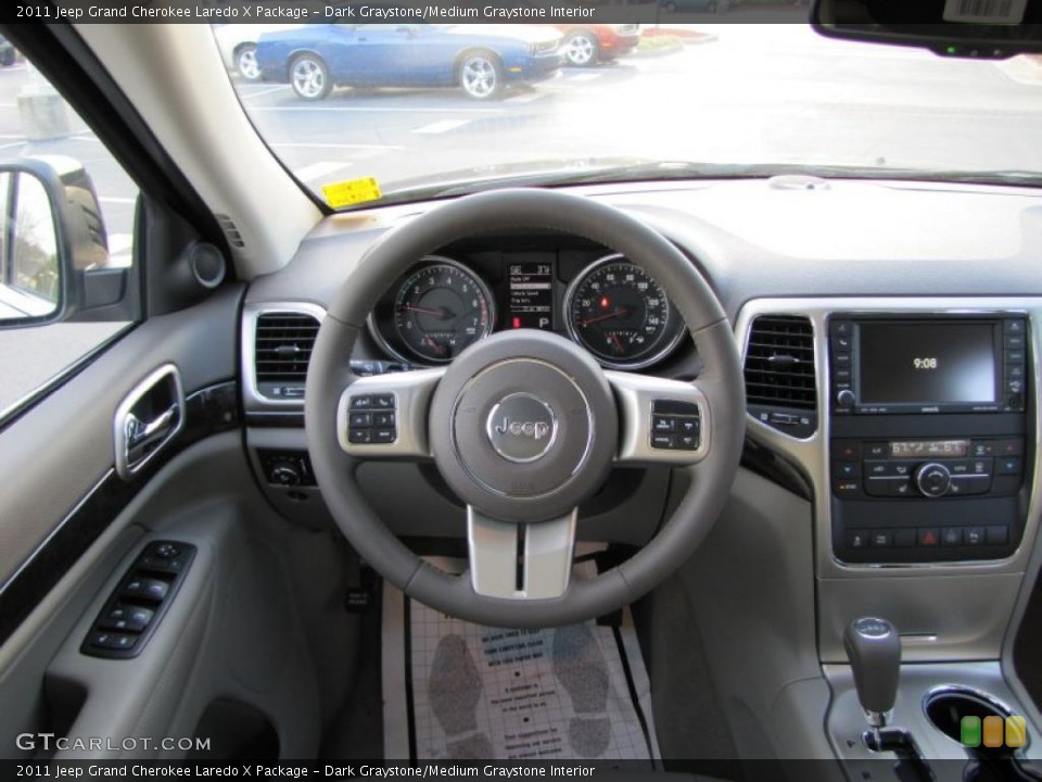 Dark Graystone/Medium Graystone Interior Steering Wheel for the 2011 Jeep Grand Cherokee Laredo X Package #42134637
