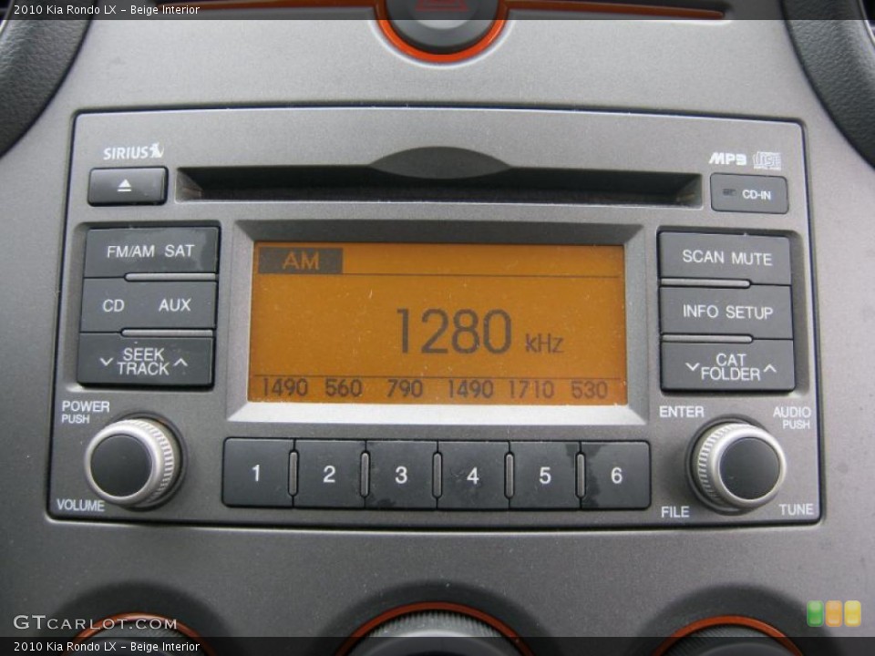 Beige Interior Controls for the 2010 Kia Rondo LX #42174996