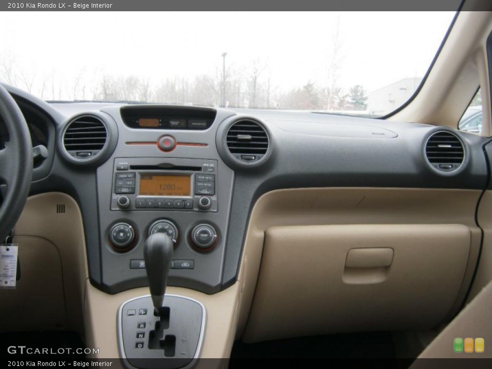Beige Interior Dashboard for the 2010 Kia Rondo LX #42175248
