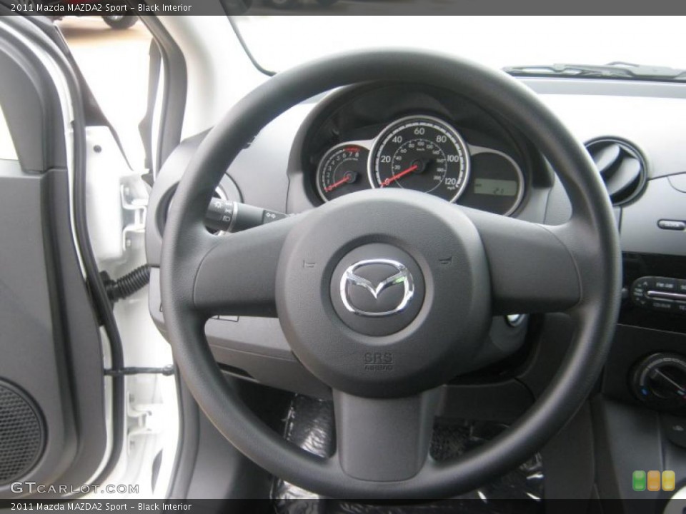 Black Interior Steering Wheel for the 2011 Mazda MAZDA2 Sport #42212351