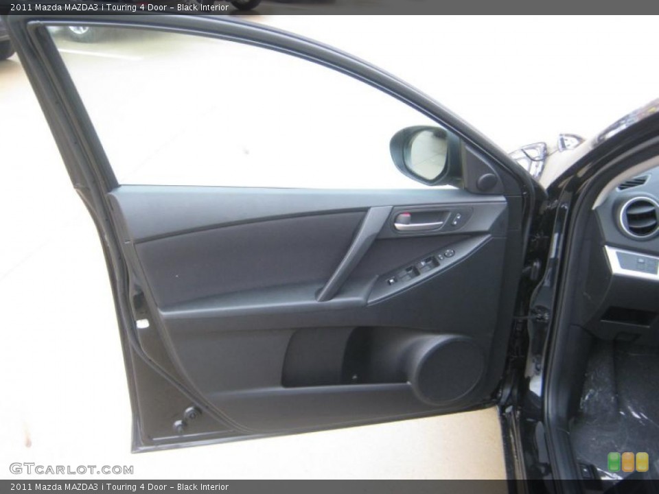 Black Interior Door Panel for the 2011 Mazda MAZDA3 i Touring 4 Door #42214099