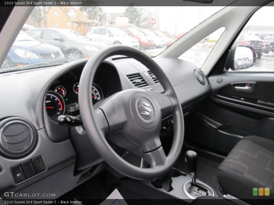 Black Interior Prime Interior for the 2010 Suzuki SX4 Sport Sedan S #42217216