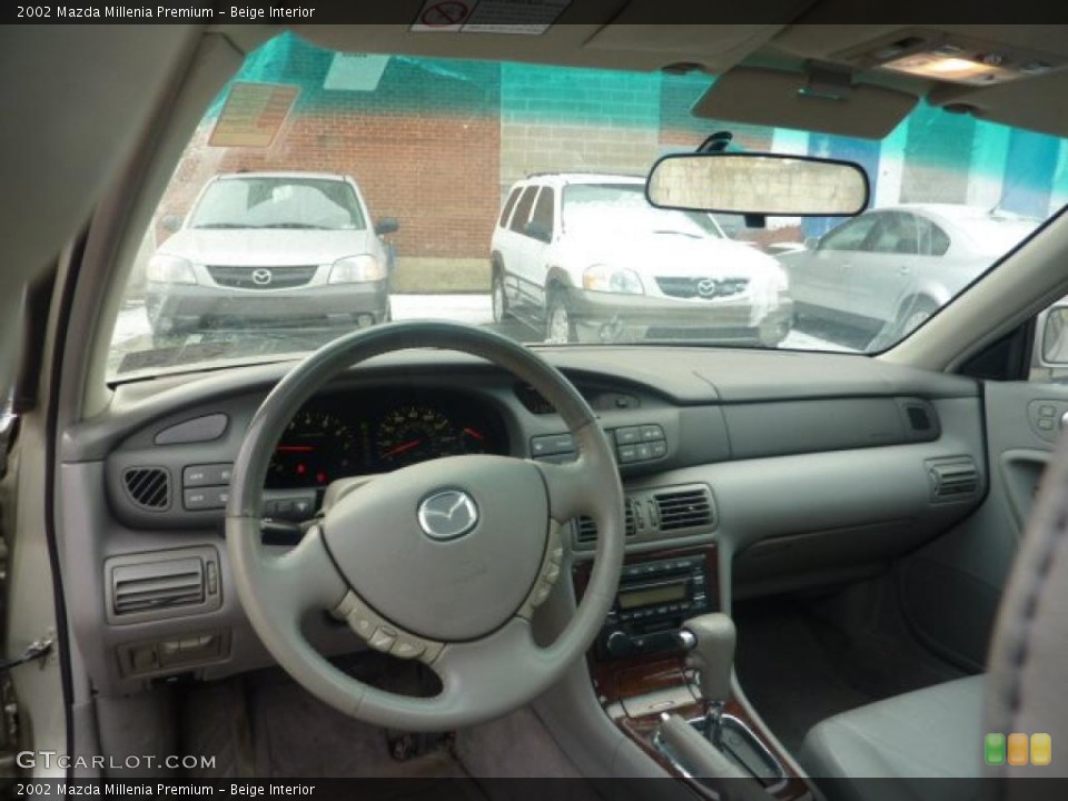 Beige Interior Dashboard for the 2002 Mazda Millenia Premium #42233452