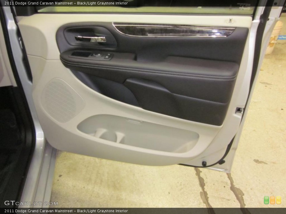 Black/Light Graystone Interior Door Panel for the 2011 Dodge Grand Caravan Mainstreet #42465267